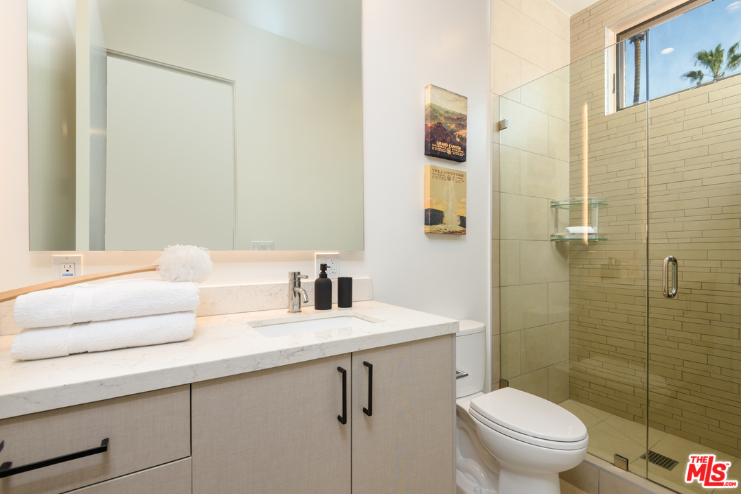 956 5th Street, Unit C Santa Monica, CA 90403 - Photo 11 of 13 a bathroom with a sink toilet and shower