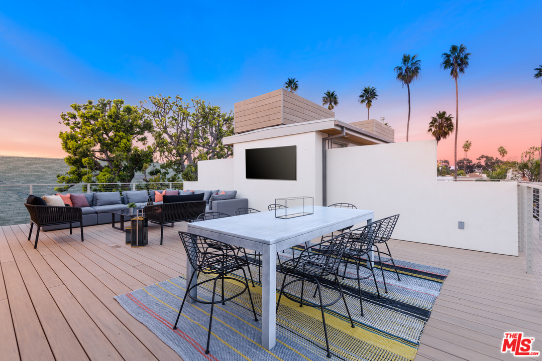 956 5th Street, Unit C Santa Monica, CA 90403 - Photo 13 of 13 a view of a terrace with furniture and wooden floor