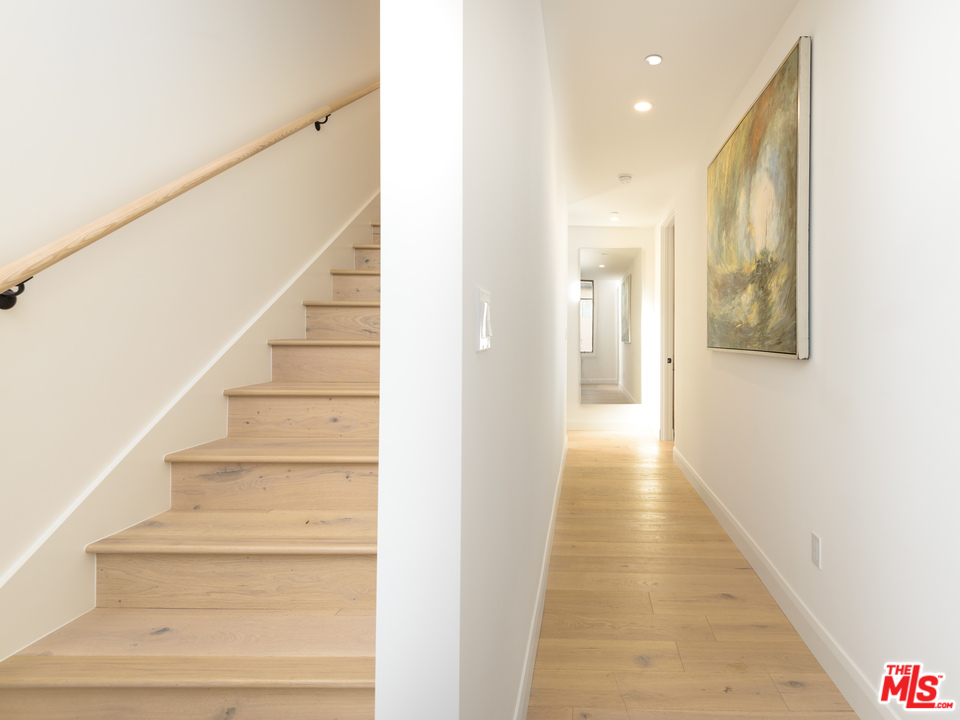 956 5th Street, Unit C Santa Monica, CA 90403 - Photo 6 of 13 a view of a hallway with wooden floor and entryway