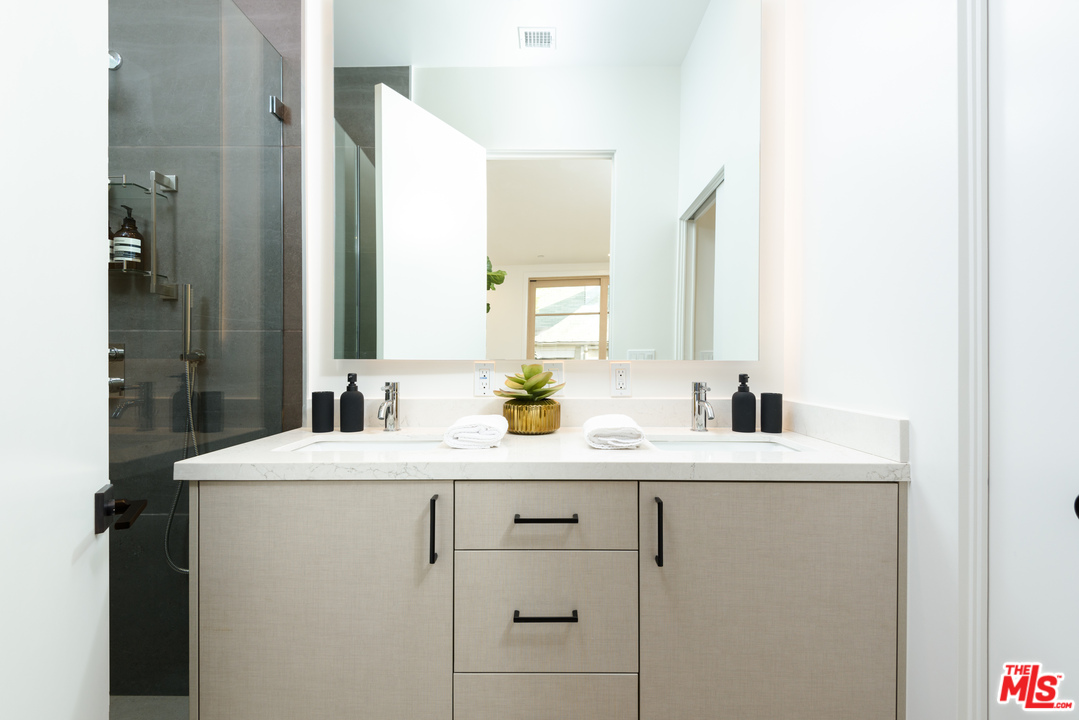 956 5th Street, Unit C Santa Monica, CA 90403 - Photo 9 of 13 a bathroom with a sink and a mirror