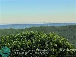 a view of multiple houses with a street
