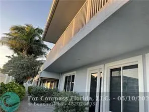 a view of a city with lush green forest