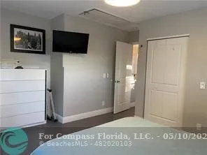a view of a livingroom with an empty space and a window