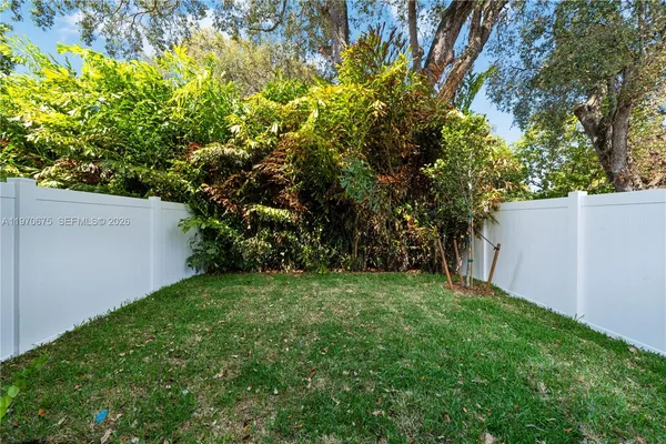 a view of backyard with a garden and plants