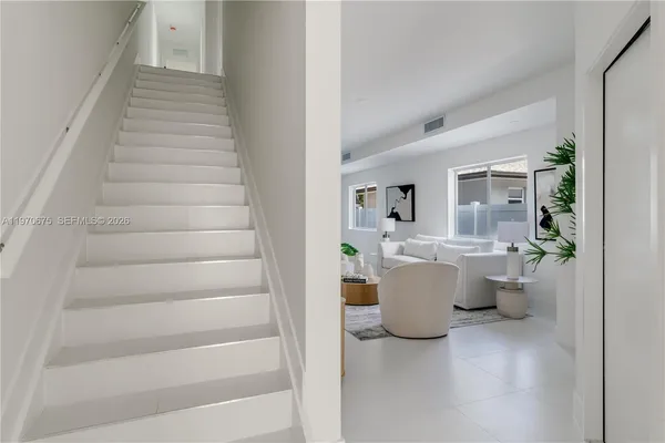 a living room with furniture and a gate