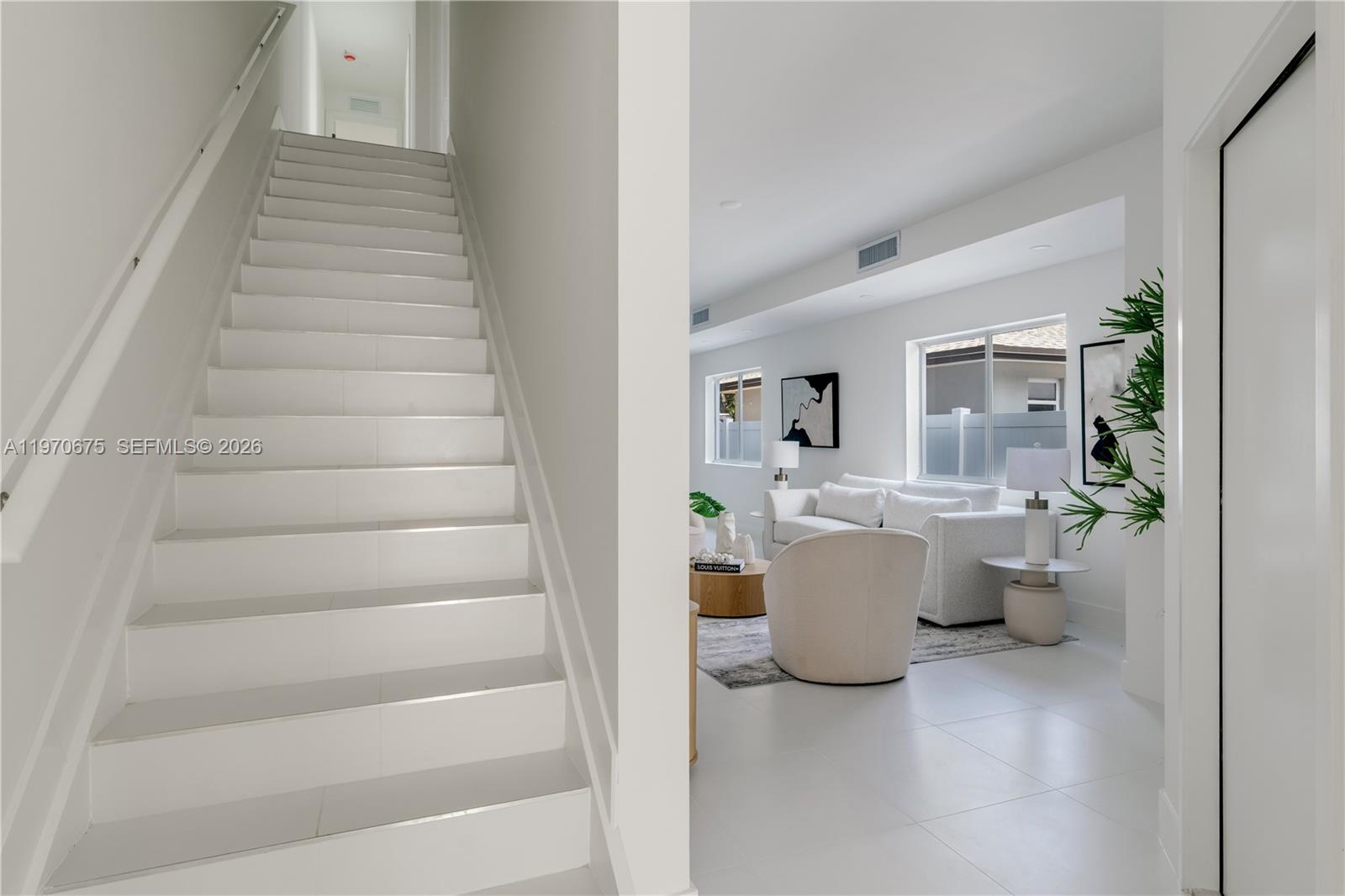 4789 Northwest 1st Street Miami, FL 33126 - Photo 5 of 28 a view of living room and kitchen with furniture