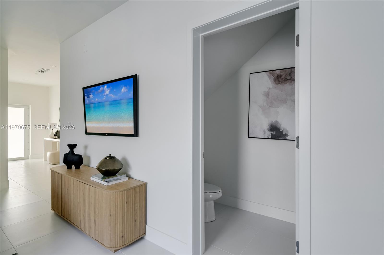 4789 Northwest 1st Street Miami, FL 33126 - Photo 6 of 28 a living room with furniture and a gate