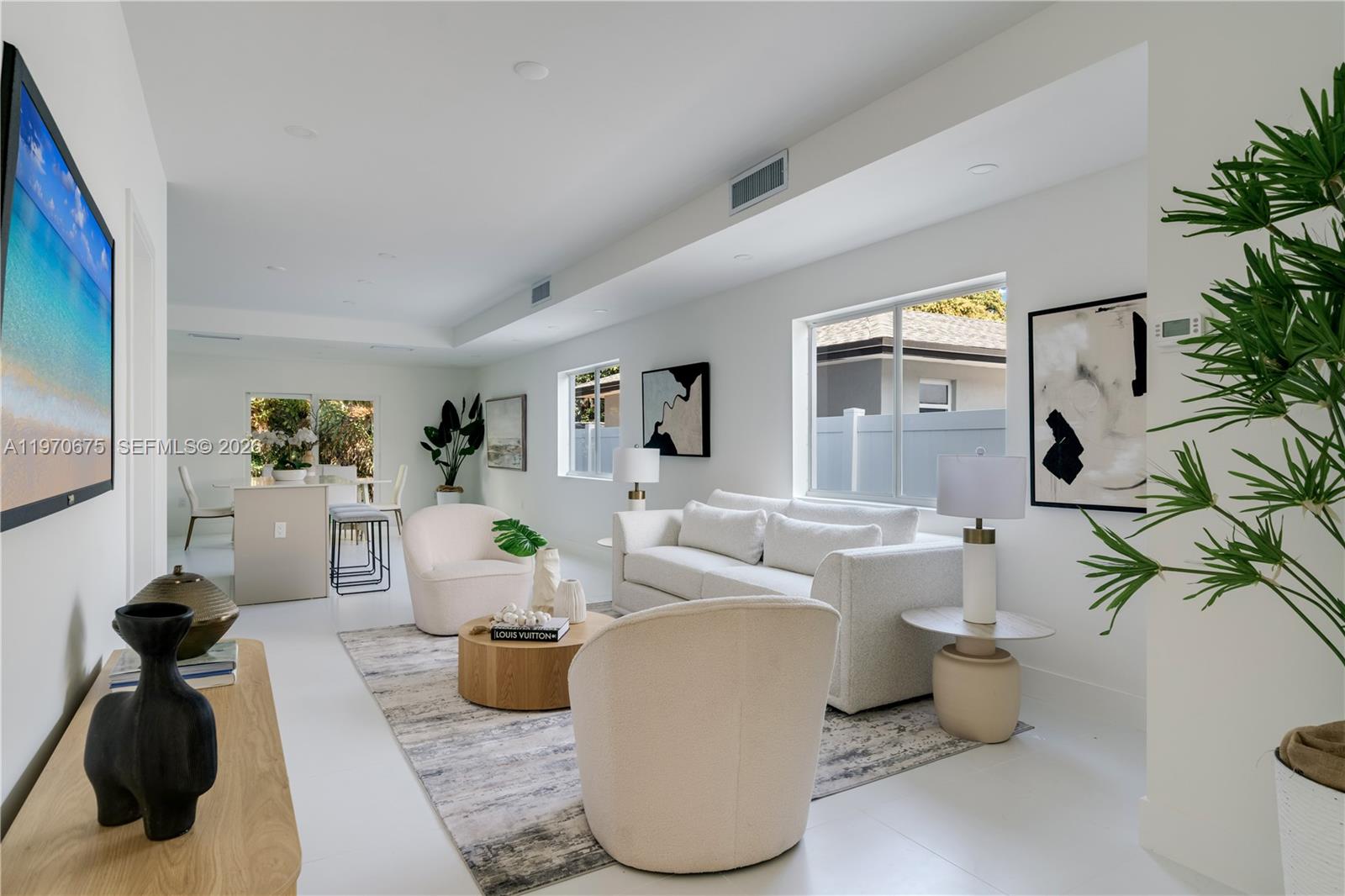 4789 Northwest 1st Street Miami, FL 33126 - Photo 8 of 28 a living room with patio furniture and a potted plant