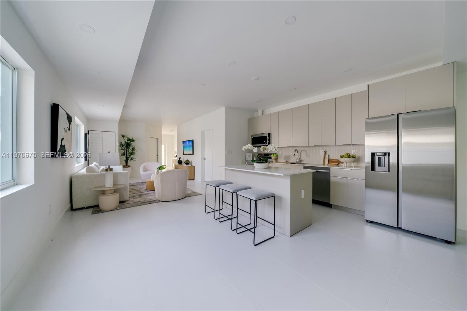4789 Northwest 1st Street Miami, FL 33126 - Photo 10 of 28 a living room with furniture and kitchen view