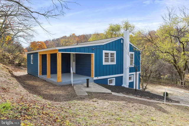 a view of a house with a snow in the yard