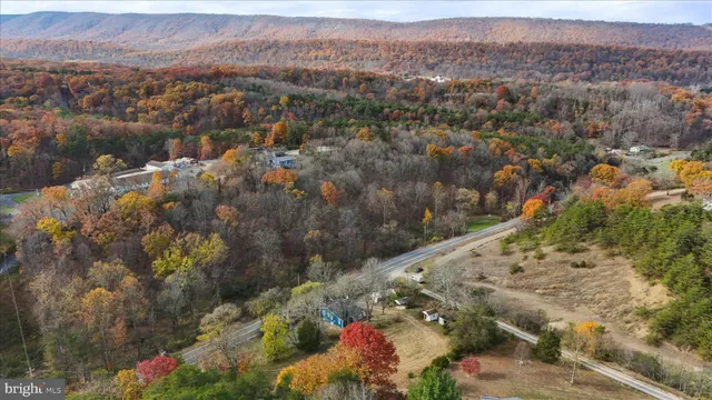 a view of a city with mountains in the background