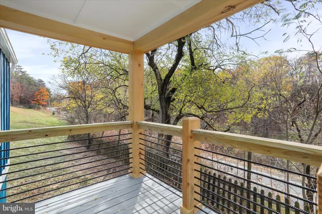a view of balcony with wooden floor