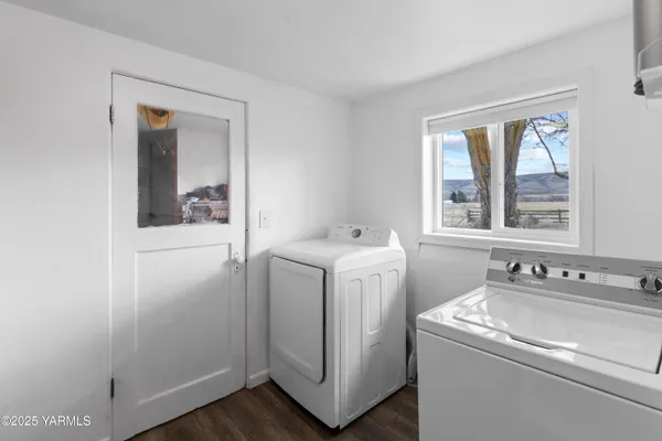 a bedroom with a bed and a mirror on dresser