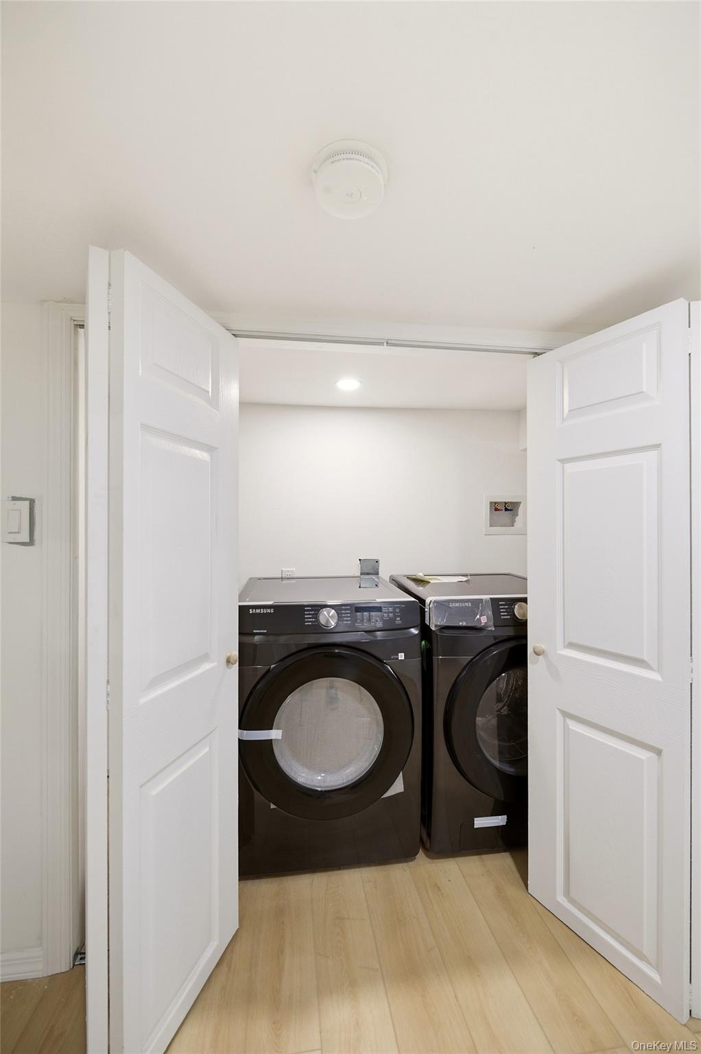 135 Whaley Street Freeport, NY 11520 - Photo 33 of 38 a utility room with dryer and washer