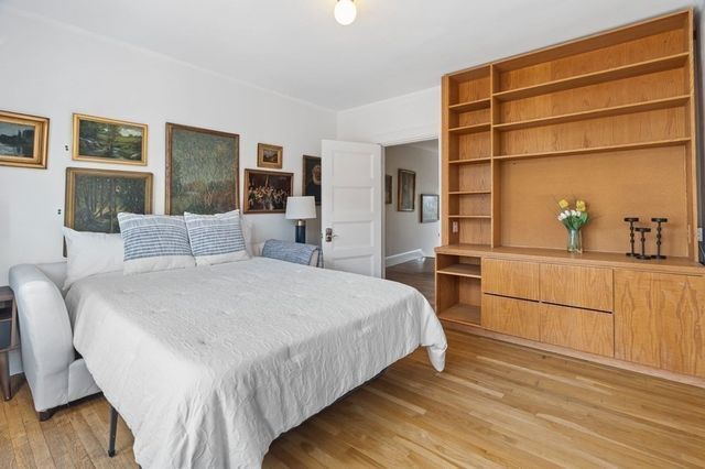a bedroom with a bed and a cabinets