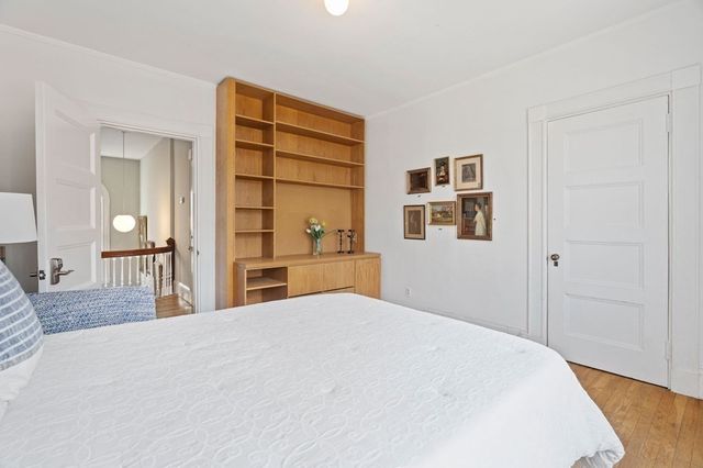 a large white bed in a white room