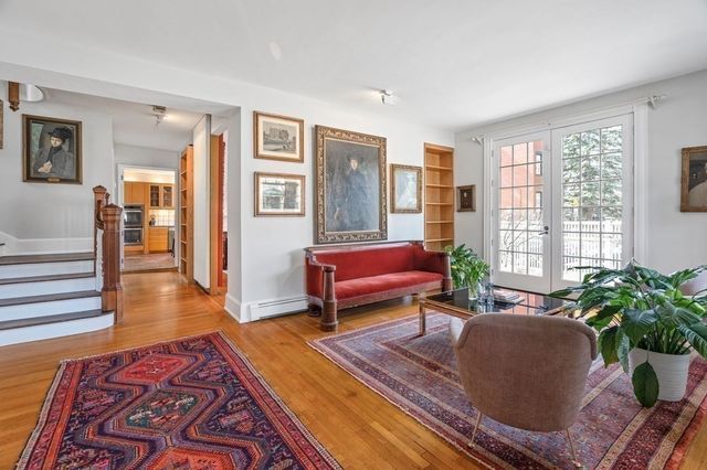a living room with furniture and a rug