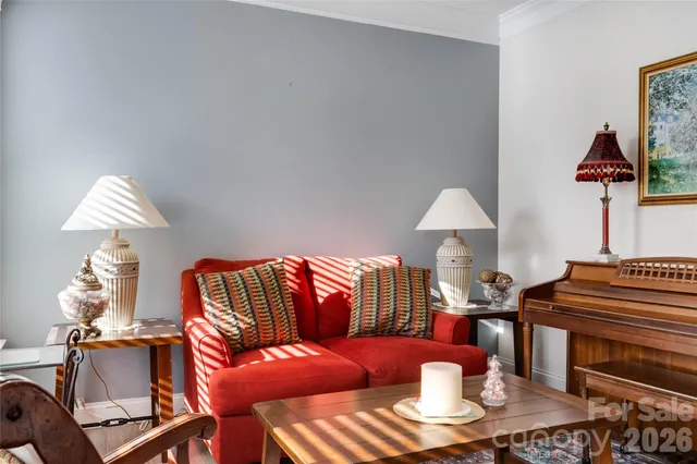 a living room with furniture and a table