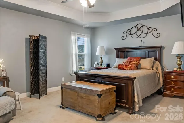 a bedroom with a bed and a table in it