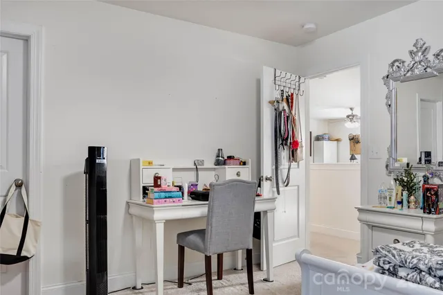 a view of workspace with furniture and window