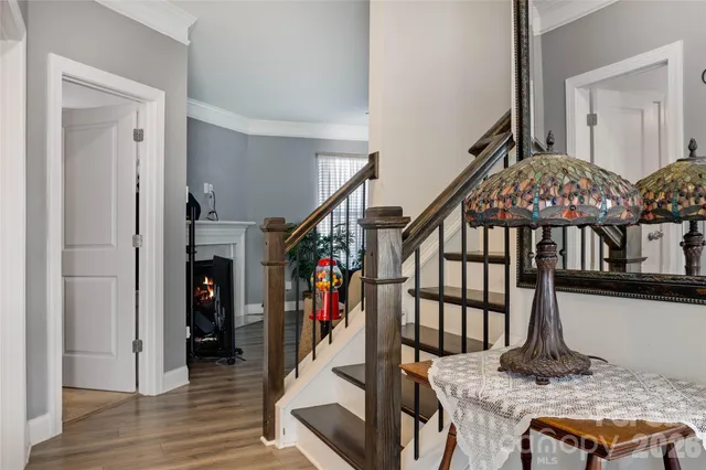 a view of entryway livingroom and hall with wooden floor