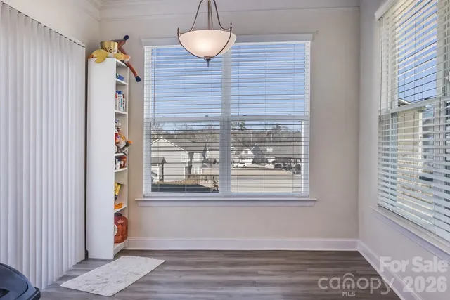a living room with furniture a lamp and a fireplace