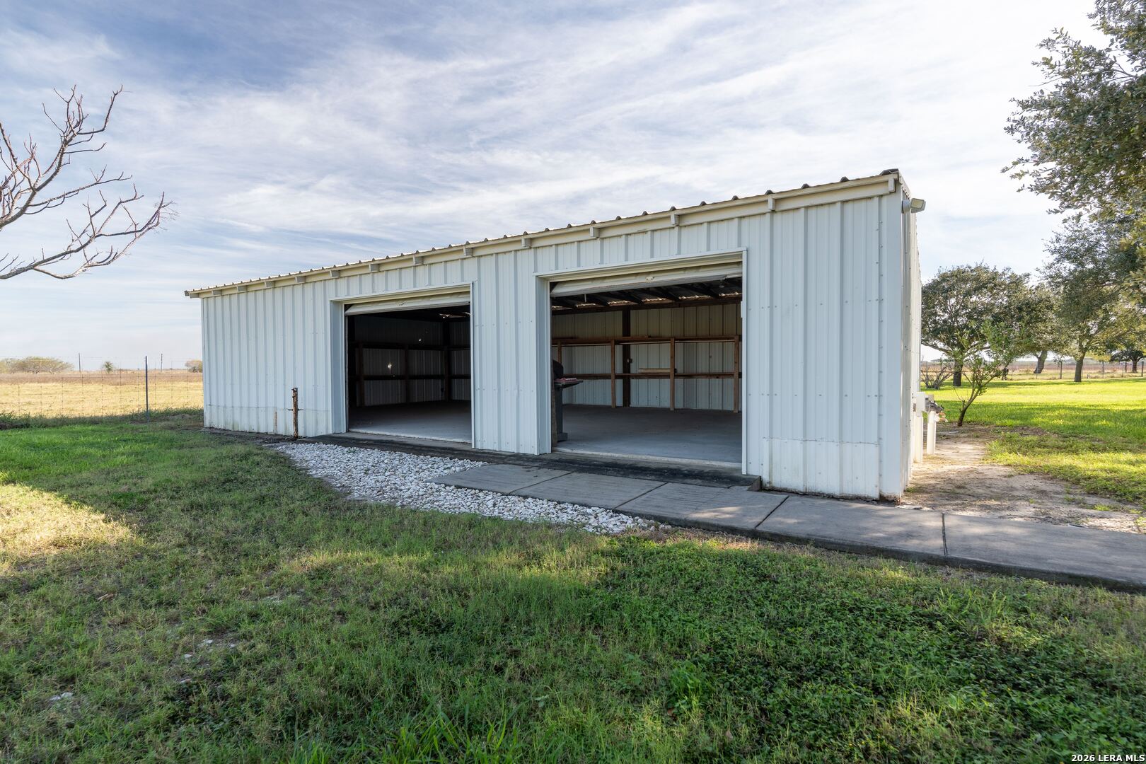 840 County Road 2250 Riviera, TX 78379 - Photo 12 of 45 front view of a house with a yard and garage