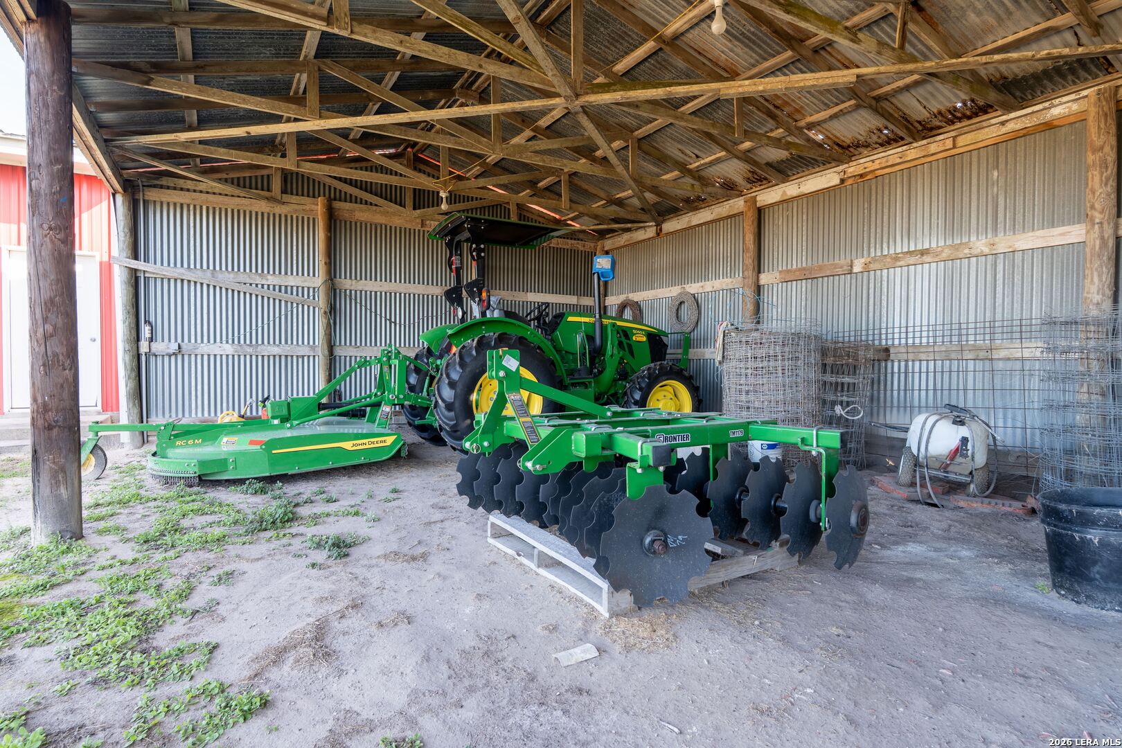 840 County Road 2250 Riviera, TX 78379 - Photo 15 of 45 a view of a garage with a table and chairs