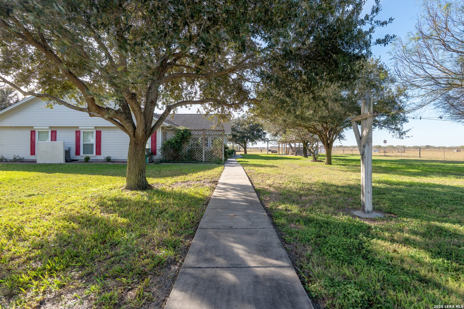 840 County Road 2250 Riviera, TX 78379 - Photo 4 of 45 a front view of a house with garden