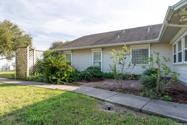 a front view of house with yard and green space