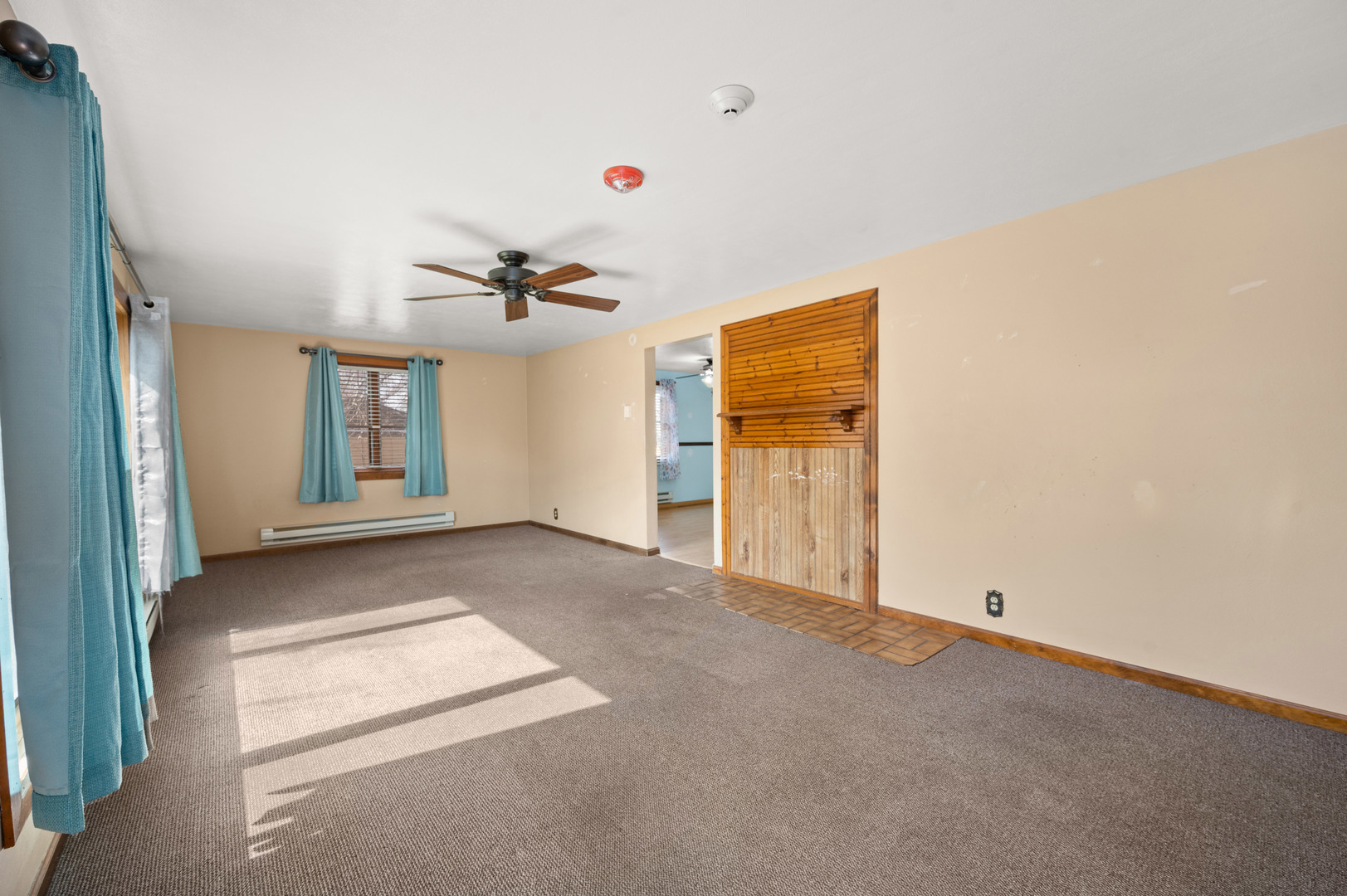10235 Rich Road DeKalb, IL 60115 - Photo 9 of 21 a view of a livingroom with a ceiling fan and window