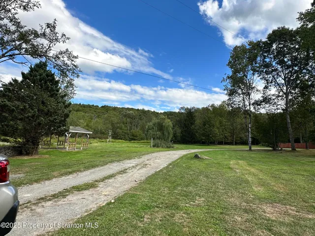 a view of a golf course with a lake