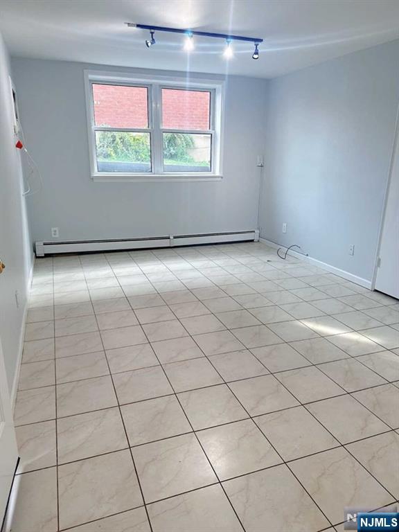 2443 3rd Street, Unit 1 Fort Lee, NJ 07024 - Photo 3 of 8 an empty room with a window