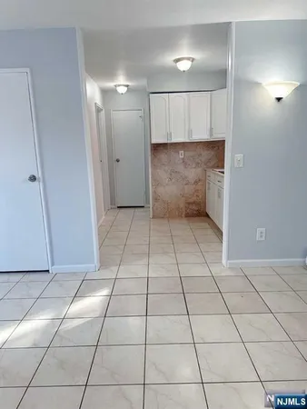 a white stove top oven sitting inside of a kitchen