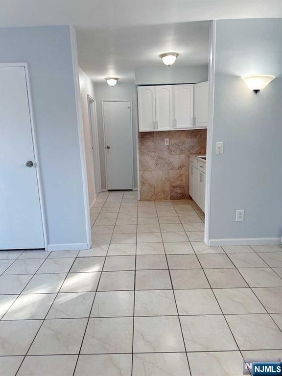 2443 3rd Street, Unit 1 Fort Lee, NJ 07024 - Photo 5 of 8 a view of a hallway to rooms