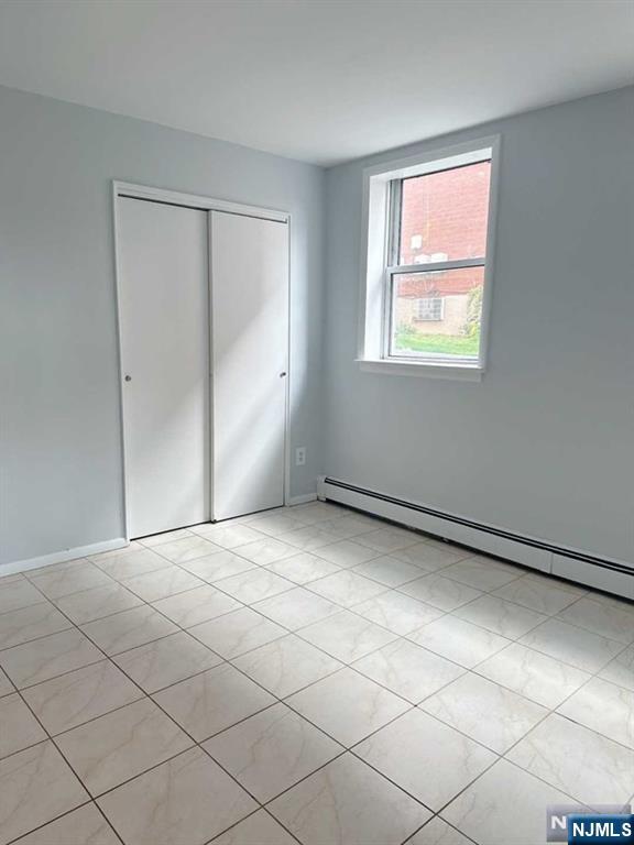2443 3rd Street, Unit 1 Fort Lee, NJ 07024 - Photo 7 of 8 a view of an empty room and window