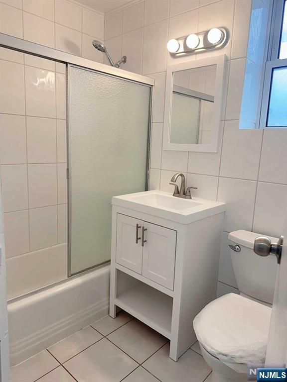 2443 3rd Street, Unit 1 Fort Lee, NJ 07024 - Photo 8 of 8 a bathroom with a sink toilet and shower