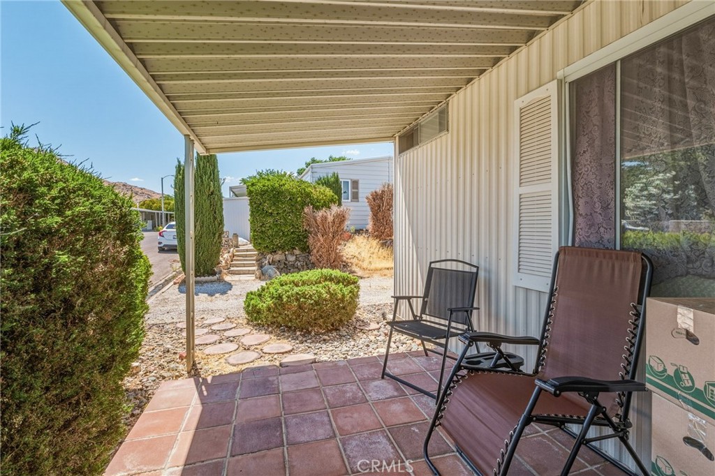 20683 Waalew Road, Unit B201 Apple Valley, CA 92307 - Photo 4 of 32 a outdoor living space with furniture and a potted plant