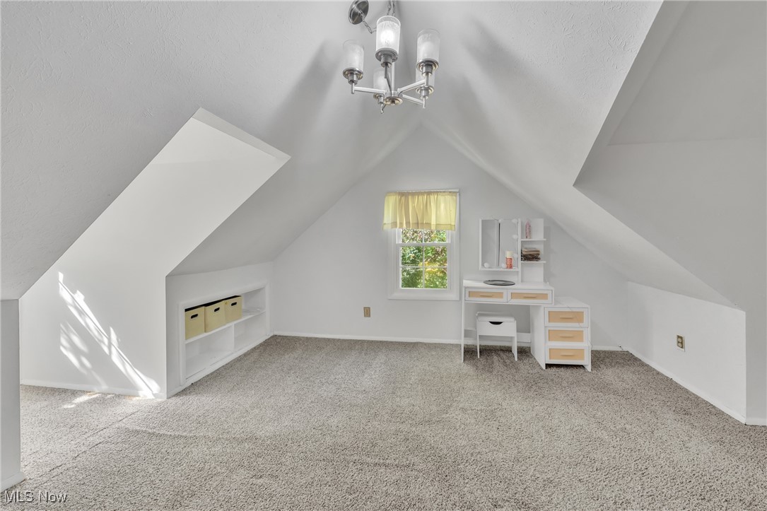 13510 Kinsman Road Burton, OH 44021 - Photo 28 of 40 2nd upstairs bedroom featuring carpet floors, vaulted ceiling, and a notable chandelier