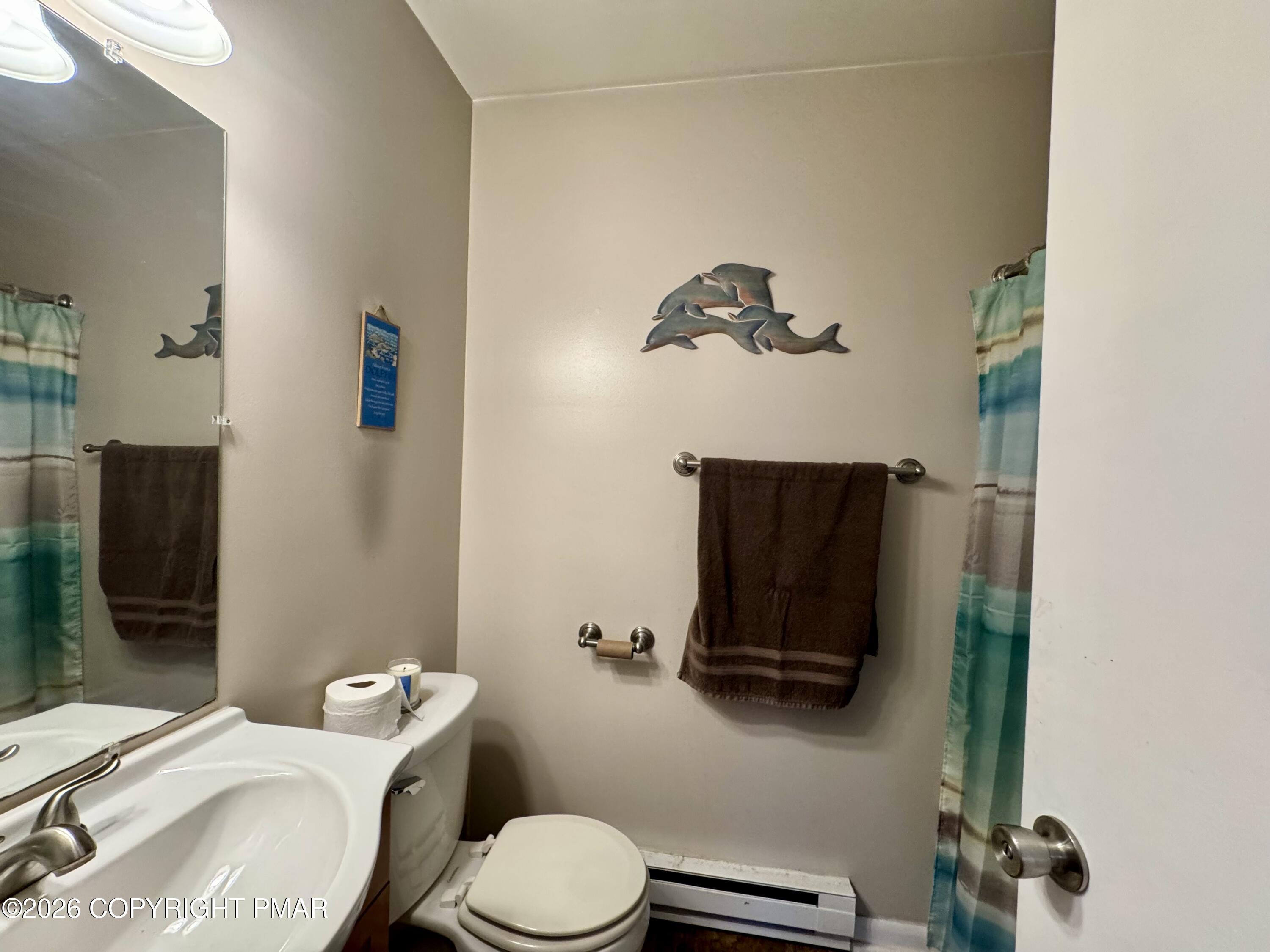 1169 Coolbaugh Road East Stroudsburg, PA 18302 - Photo 11 of 26 a bathroom with a toilet and a mirror