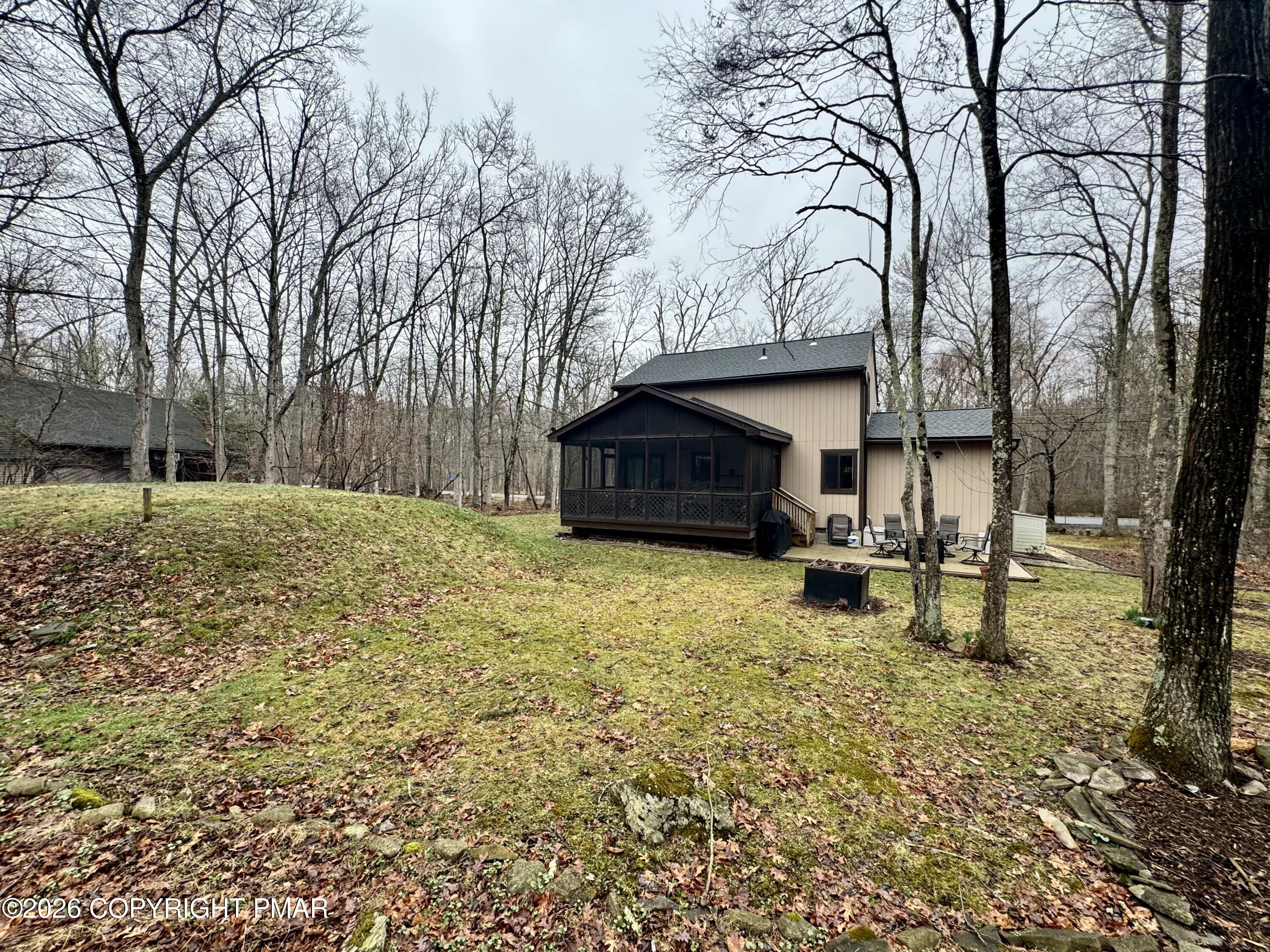 1169 Coolbaugh Road East Stroudsburg, PA 18302 - Photo 22 of 26 a house with trees in front of it