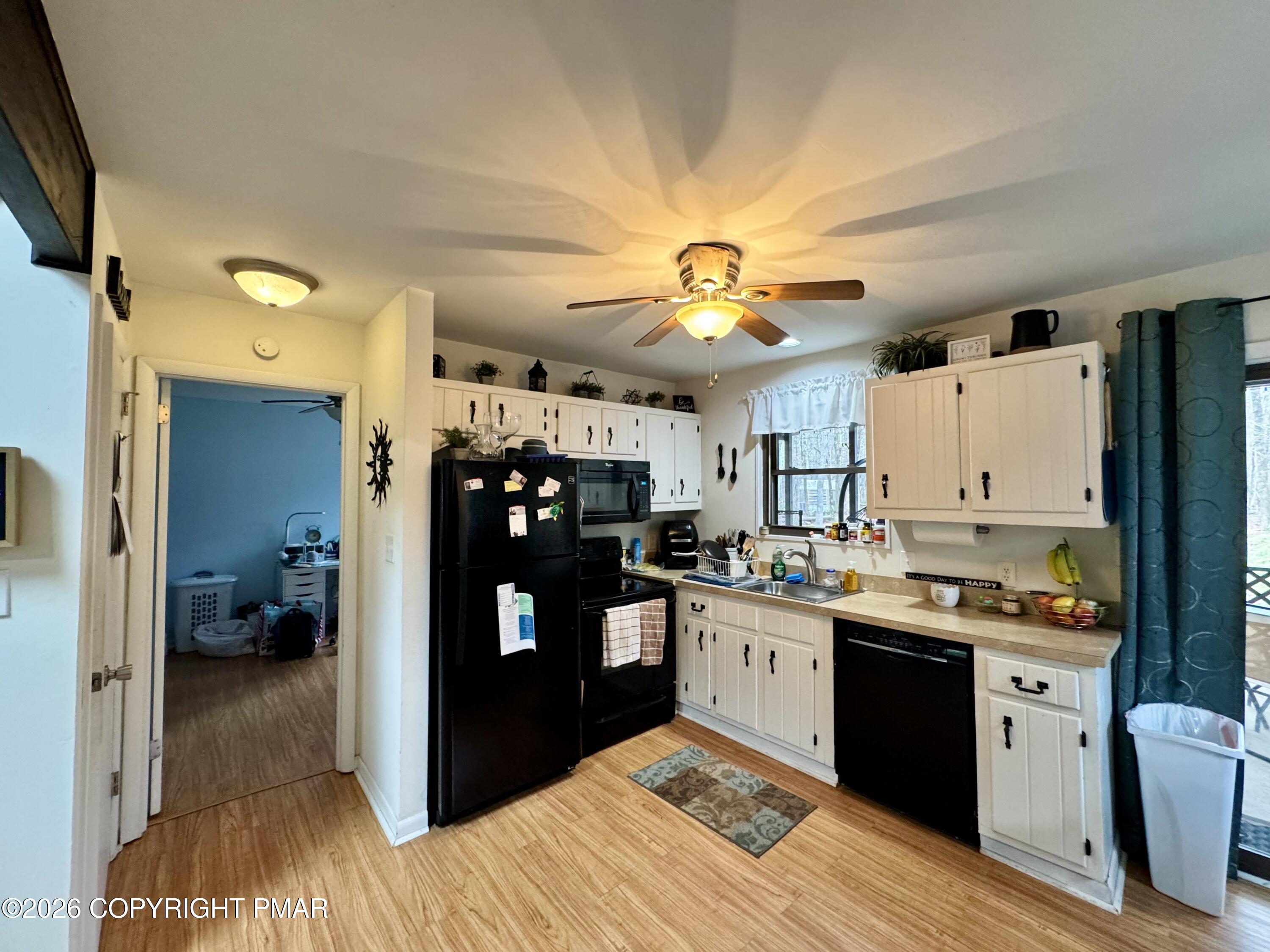 1169 Coolbaugh Road East Stroudsburg, PA 18302 - Photo 5 of 26 a kitchen view with stainless steel appliances kitchen island granite countertop a refrigerator and a sink