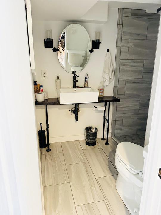 1911 D Street Northeast Washington, DC 20002 - Photo 40 of 63 Basement full bath with shower and bench/window