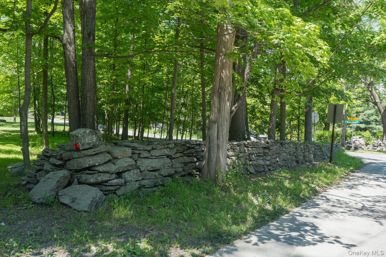 185 Taylor Road Mountainville, NY 10953 - Photo 41 of 47 Stone wall lines the property at the road and along the property line
