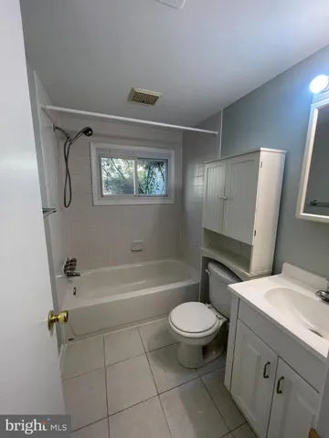 a bathroom with a bathtub toilet and sink