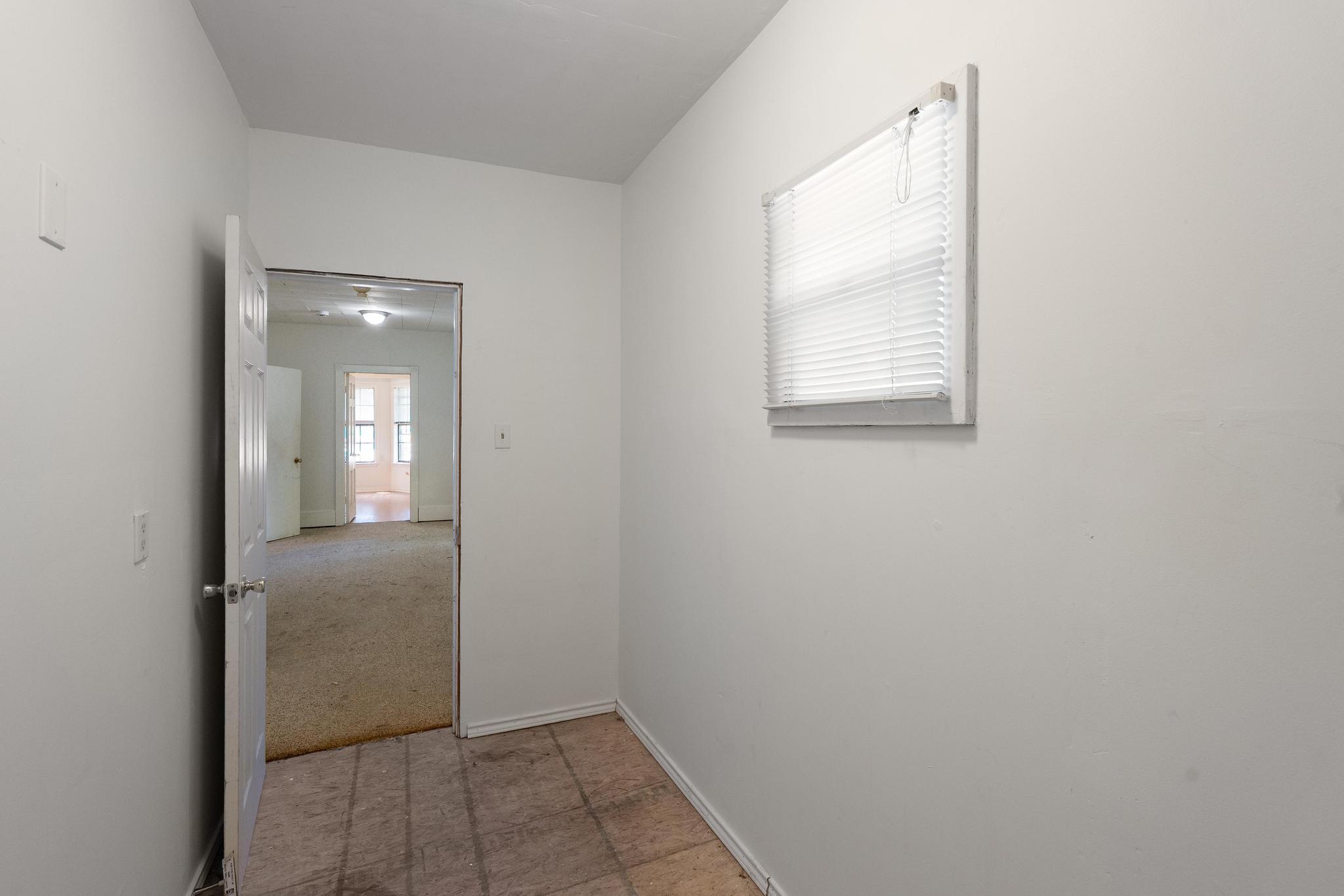 4616 East Cesar Chavez Street Austin, TX 78702 - Photo 8 of 22 an empty room with windows and closet