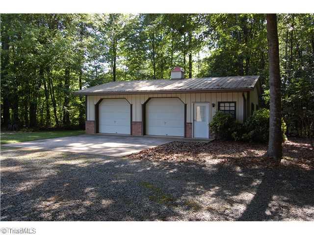 6051 Whites Chapel Road Staley, NC 27355 - Photo 9 of 15 Parking Lot/Garage. Detached garage with lots of storage