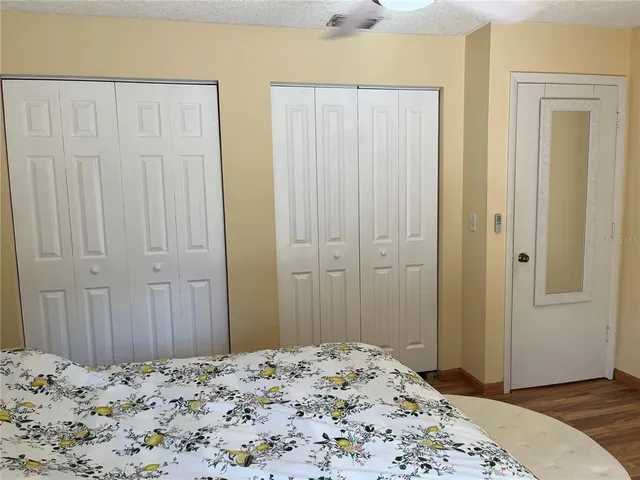 a bedroom with a bed and hallway