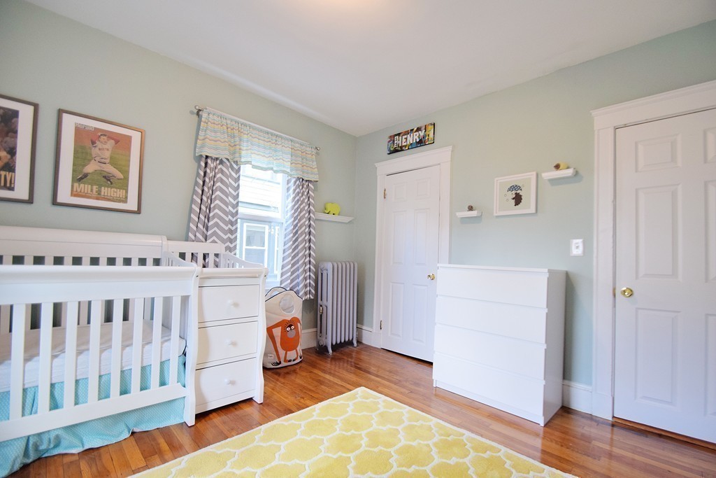 91-93 Rossmore Road, Unit 1 Boston, MA 02130 - Photo 12 of 16 a bedroom with a bed and a window