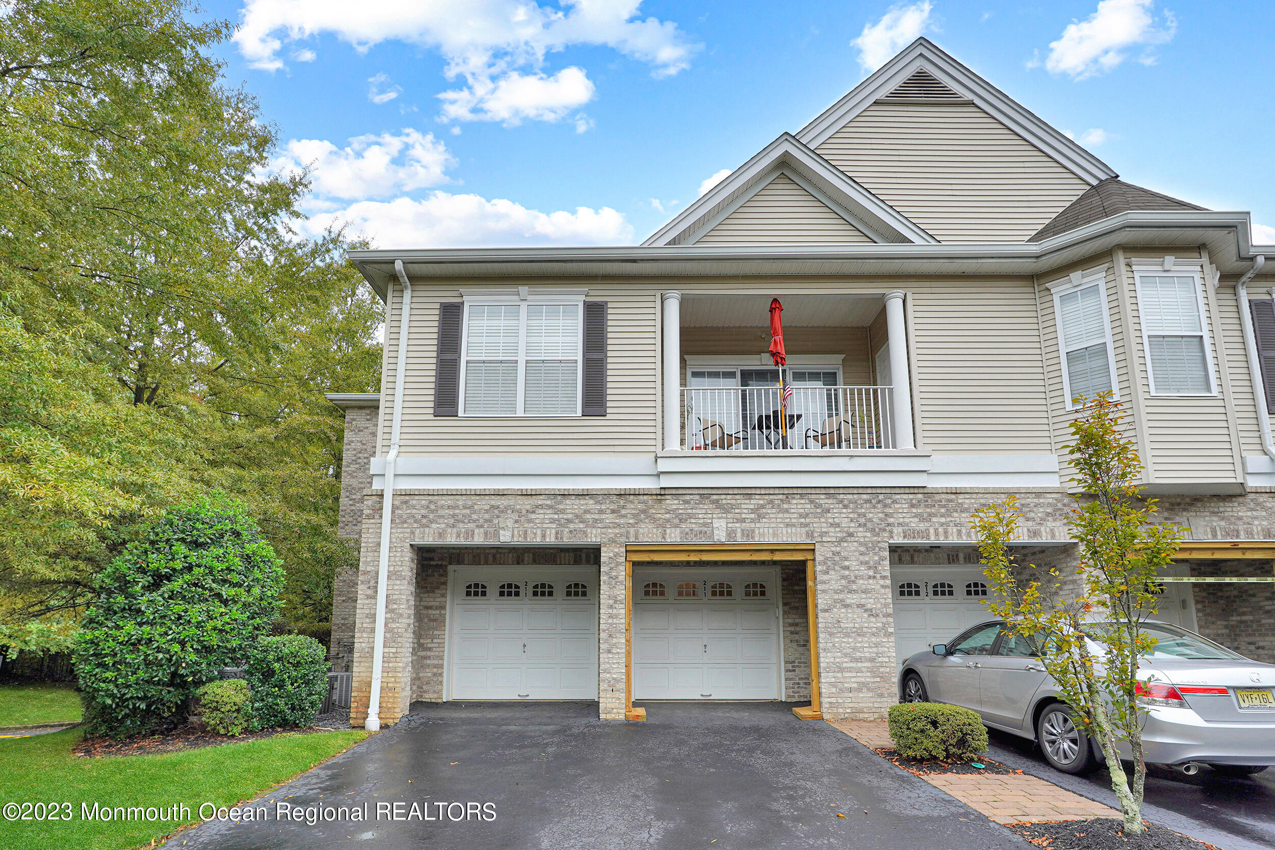 211 Potts Road Morganville, NJ 07751 - Photo 1 of 29 a front view of a house with garden